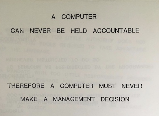 A slide from an presentation that says “A computer can never be held accountable. Therefore a computer must never make a management decision.